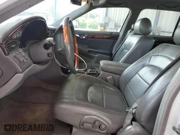 2004 Cadillac DeVille DTS z VIN 1G6KF57924U185324, wystawiony jako Copart lot #58222205 z przebiegiem 182 640 mil mil oraz Szkoda całkowita • Salvage title. Historia ofert i sprzedaży dostępna na DreamBid. Obrazek 7.