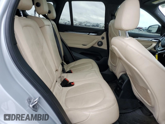 2017 BMW X1 sDrive28i with VIN WBXHU7C33H5H34013, listed as a Copart auction lot 38409444 with 87,558 mi miles and Salvage Title. Bid and sale history available at carsss.com. Image 10.