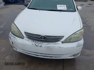 2003 Toyota Camry LE z VIN JTDBF30K530148403, wystawiony jako IAAI lot #41688346 z przebiegiem 299 143 mil mil oraz . Historia ofert i sprzedaży dostępna na DreamBid. Obrazek 18.