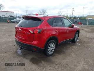 2014 Mazda CX-5 Touring z VIN JM3KE2CY3E0424892, wystawiony jako IAAI lot #42016801 z przebiegiem 173 350 mil mil oraz . Historia ofert i sprzedaży dostępna na DreamBid. Obrazek 4.