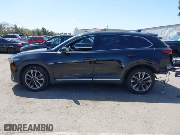 2016 Mazda CX-9 Grand Touring with VIN JM3TCBDY4G0113693, listed as a IAAI auction lot 41965857 with 152,403 mi miles and . Bid and sale history available at DreamBid. Image 15.