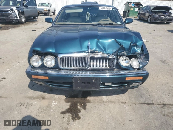 1996 Jaguar XJ z VIN SAJHX1746TC756451, wystawiony jako Copart lot #48991655 z przebiegiem 115 015 mil mil oraz Szkoda całkowita • Salvage title. Historia ofert i sprzedaży dostępna na DreamBid. Obrazek 5.