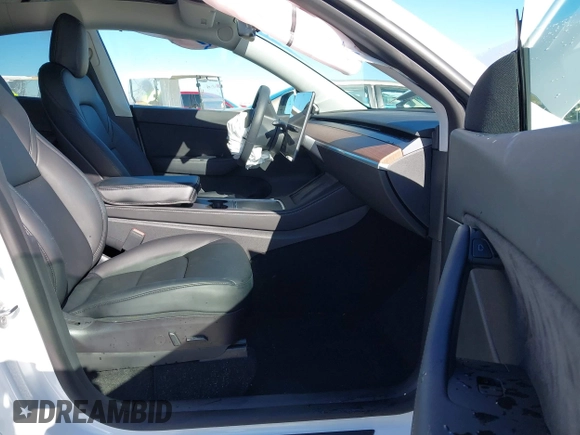 2022 Tesla Model Y Long Range with VIN 7SAYGDEE1NF402745, listed as a IAAI auction lot 41493850 with 11,222 mi miles and . Bid and sale history available at DreamBid. Image 5.