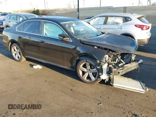 2015 Volkswagen Passat 1.8T Wolfsburg Ed with VIN 1VWAT7A30FC092809, listed as a IAAI auction lot 41728191 with 160,941 mi miles. Bid and sale history available at carsss.com. Image 1.
