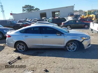 2016 Ford Fusion Titanium Hybrid with VIN 3FA6P0RU7GR364573, listed as a IAAI auction lot 41298298 with 189,900 mi miles. Bid and sale history available at carsss.com. Image 13.