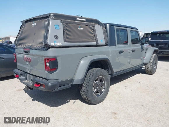 2022 Jeep Gladiator Rubicon z VIN 1C6JJTBG2NL167034, wystawiony jako IAAI lot #41854225 z przebiegiem Nie podano mil oraz . Historia ofert i sprzedaży dostępna na DreamBid. Obrazek 4.