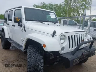 2015 Jeep Wrangler Unlimited Sahara with VIN 1C4BJWEG1FL506393, listed as a IAAI auction lot 42326900 with 100,538 mi miles and . Bid and sale history available at DreamBid. Image 1.