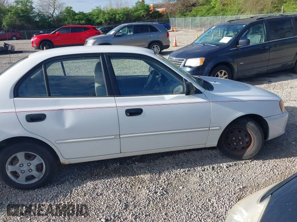 2002 Hyundai Accent GL with VIN KMHCG45C92U347708, listed as a IAAI auction lot 42137086 with 73,271 mi miles. Bid and sale history available at carsss.com. Image 6.