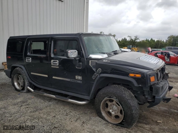 2003 Hummer H2 with VIN 5GRGN23UX3H121939, listed as a Copart auction lot 69503424 with 170,144 mi miles and Salvage Title. Bid and sale history available at carsss.com. Image 4.