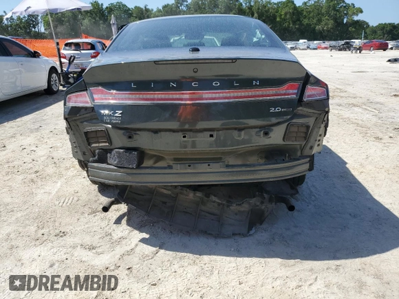 2016 Lincoln MKZ с VIN 3LN6L2G95GR606837, выставлен на аукционе Copart как лот 57356815 с пробегом 67 898 миль миль и Списание • Salvage title. История ставок и продаж доступна на DreamBid. Изображение 6.
