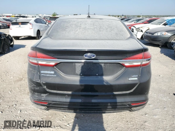 2017 Ford Fusion SE z VIN 3FA6P0H98HR179253, wystawiony jako Copart lot #52015345 z przebiegiem 99 883 mil mil oraz Czysty tytuł • Clean title. Historia ofert i sprzedaży dostępna na DreamBid. Obrazek 6.
