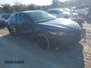 2019 Toyota Camry LE z VIN 4T1B11HK5KU773460, wystawiony jako IAAI lot #41574997 z przebiegiem 63 498 mil mil oraz . Historia ofert i sprzedaży dostępna na DreamBid. Obrazek 1.