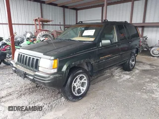 1997 Jeep Grand Cherokee Limited with VIN 1J4GZ78Y5VC723429, listed as a IAAI auction lot 42012836 with 231,126 mi miles. Bid and sale history available at carsss.com. Image 2.