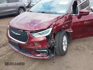 2021 Chrysler Pacifica Touring L with VIN 2C4RC1BG6MR597911, listed as a IAAI auction lot 41660729 with 72,004 mi miles and . Bid and sale history available at DreamBid. Image 6.