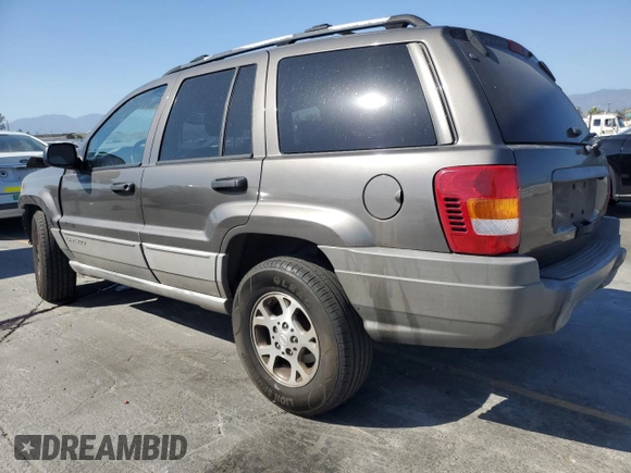 2000 Jeep Grand Cherokee Laredo with VIN 1J4G248S2YC377133, listed as a Copart auction lot 57916785 with 217,525 mi miles and Salvage title. Bid and sale history available at DreamBid. Image 2.
