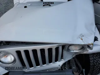 2006 Jeep Wrangler Unlimited LWB with VIN 1J4FA44S66P757473, listed as a Copart auction lot 50405835 with 143,685 mi miles and Salvage Title. Bid and sale history available at carsss.com. Image 12.