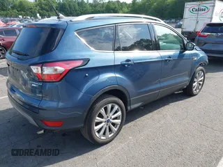2018 Ford Escape Titanium with VIN 1FMCU9J92JUB01162, listed as a IAAI auction lot 42495112 with 96,280 mi miles and . Bid and sale history available at DreamBid. Image 4.