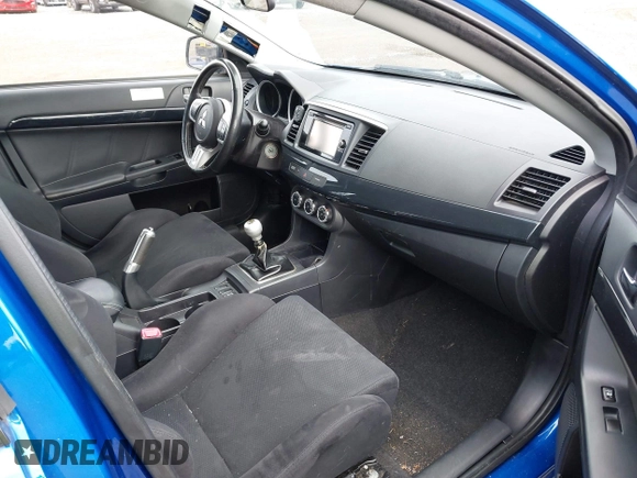 2015 Mitsubishi Lancer Evolution GSR with VIN JA32W8FV4FU012578, listed as a IAAI auction lot 41730742 with 64,762 mi miles. Bid and sale history available at carsss.com. Image 5.