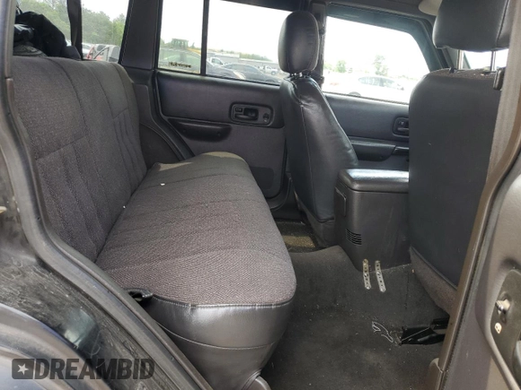 1999 Jeep Cherokee Sport with VIN 1J4FF68S9XL635836, listed as a Copart auction lot 59573195 with 187,035 mi miles and Salvage title. Bid and sale history available at DreamBid. Image 11.