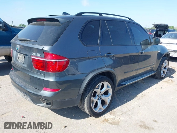 2012 BMW X5 35d with VIN 5UXZW0C51CL669957, listed as a IAAI auction lot 42230292 with 102,305 mi miles and . Bid and sale history available at DreamBid. Image 4.