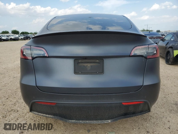2022 Tesla Model Y Performance with VIN 7SAYGDEF2NF460730, listed as a Copart auction lot 54127945 with 59,735 mi miles and Salvage title. Bid and sale history available at DreamBid. Image 6.