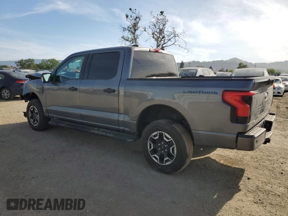 2023 Ford F-150 Lightning Pro z VIN 1FTVW1EL8PWG36508, wystawiony jako Copart lot #54178165 z przebiegiem 18 928 mil mil oraz Szkoda całkowita • Salvage title. Historia ofert i sprzedaży dostępna na DreamBid. Obrazek 2.