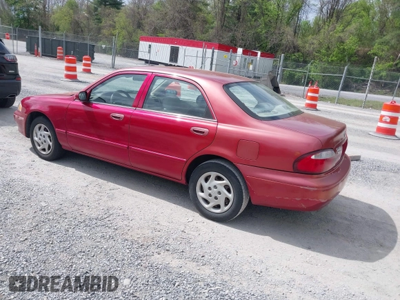 2000 Mazda 626 LX with VIN 1YVGF22C8Y5115891, listed as a IAAI auction lot 42121137 with 186,165 mi miles. Bid and sale history available at carsss.com. Image 3.
