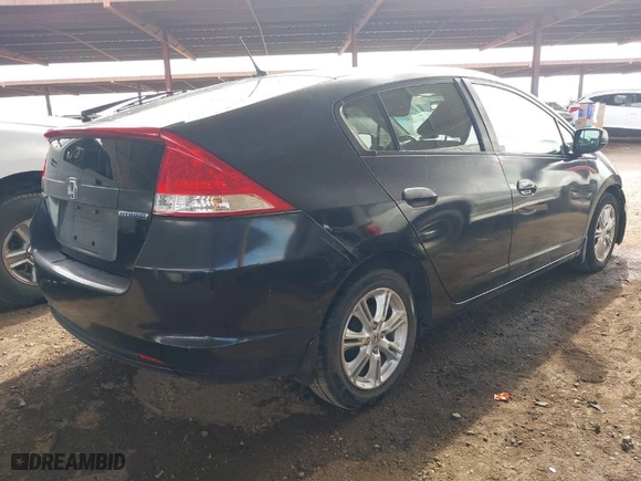 2011 Honda Insight EX with VIN JHMZE2H70BS011379, listed as a IAAI auction lot 41606111 with 220,543 mi miles. Bid and sale history available at carsss.com. Image 4.