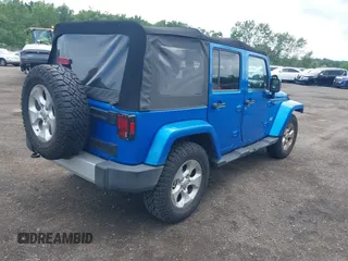 2015 Jeep Wrangler Unlimited Sahara with VIN 1C4BJWEG4FL677879, listed as a IAAI auction lot 42676097 with 85,821 mi miles and . Bid and sale history available at DreamBid. Image 4.