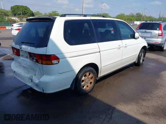 2002 Honda Odyssey EX z VIN 2HKRL18632H556791, wystawiony jako IAAI lot #41562553 z przebiegiem 222 976 mil mil oraz . Historia ofert i sprzedaży dostępna na DreamBid. Obrazek 4.