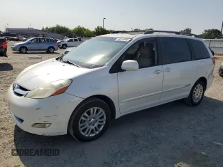 2010 Toyota Sienna XLE with VIN 5TDYK4CC7AS292156, listed as a Copart auction lot 59212095 with 243,601 mi miles and Salvage title. Bid and sale history available at DreamBid. Image 1.