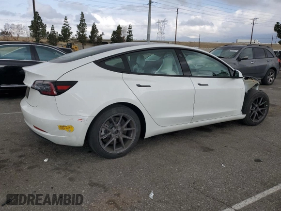 2021 Tesla Model 3 Standard Range Plus with VIN 5YJ3E1EA6MF066064, listed as a Copart auction lot 54063625 with 27,424 mi miles and Salvage Title. Bid and sale history available at DreamBid. Image 3.