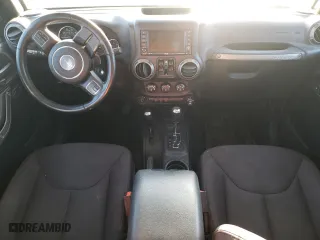 2015 Jeep Wrangler Unlimited Sport with VIN 1C4HJWDG9FL598249, listed as a Copart auction lot 49775035 with 116,486 mi miles and Salvage Title. Bid and sale history available at carsss.com. Image 8.