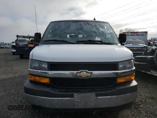 2018 Chevrolet Express Passenger LT with VIN 1GAZGPFG3J1245055, listed as a Copart auction lot 87807965 with 106,634 mi miles and Salvage title. Bid and sale history available at DreamBid. Image 5.