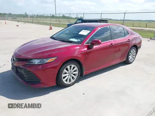 2020 Toyota Camry LE with VIN 4T1L11AK3LU993342, listed as a IAAI auction lot 42033420 with 84,849 mi miles and . Bid and sale history available at DreamBid. Image 2.