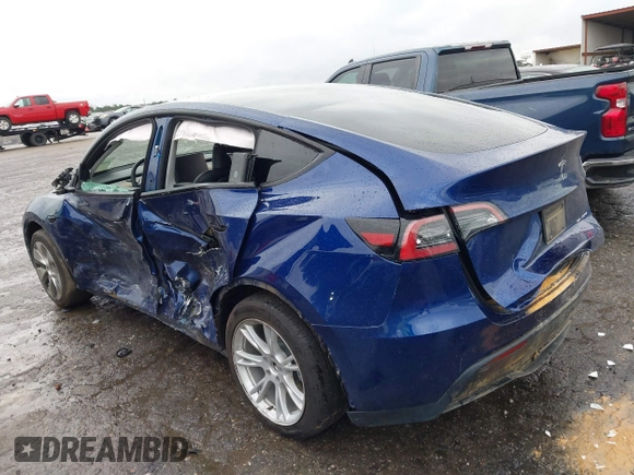 2023 Tesla Model Y Long Range with VIN 7SAYGDEE7PF673988, listed as a IAAI auction lot 41057651 with 29,683 mi miles and . Bid and sale history available at DreamBid. Image 3.