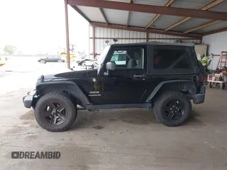 2015 Jeep Wrangler Sport with VIN 1C4AJWAG8FL550635, listed as a IAAI auction lot 42116285 with 111,782 mi miles. Bid and sale history available at carsss.com. Image 14.
