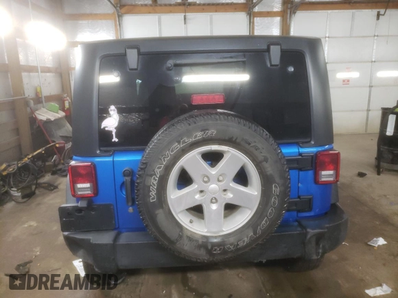 2015 Jeep Wrangler Willys Wheeler with VIN 1C4AJWAG2FL568130, listed as a Copart auction lot 80682914 with 111,686 mi miles and Salvage title. Bid and sale history available at DreamBid. Image 6.