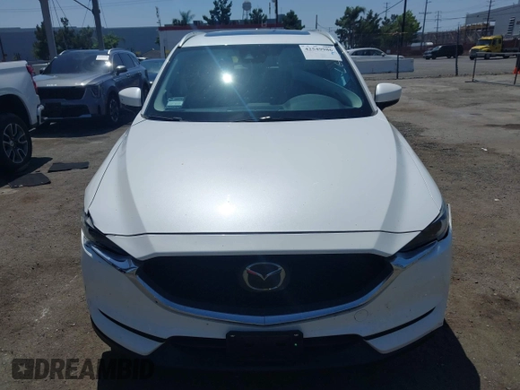 2020 Mazda CX-5 Grand Touring with VIN JM3KFADM9L0821930, listed as a IAAI auction lot 42549986 with 29,929 mi miles and . Bid and sale history available at DreamBid. Image 12.