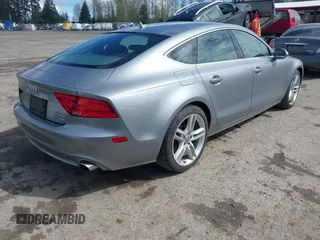 2014 Audi A7 Premium Plus z VIN WAUWGAFC4EN160144, wystawiony jako IAAI lot #41970181 z przebiegiem 118 761 mil mil oraz . Historia ofert i sprzedaży dostępna na DreamBid. Obrazek 4.