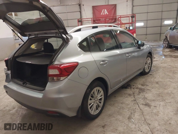 2017 Subaru Impreza Premium z VIN 4S3GTAB63H3705818, wystawiony jako IAAI lot #41568064 z przebiegiem 132 046 mil mil oraz . Historia ofert i sprzedaży dostępna na DreamBid. Obrazek 4.