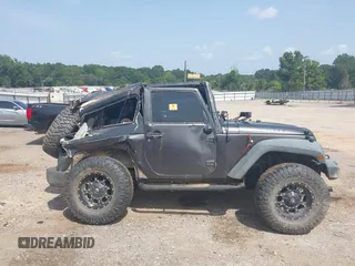 2014 Jeep Wrangler Sport with VIN 1C4AJWAGXEL233647, listed as a IAAI auction lot 39993785 with Not Provided miles and . Bid and sale history available at DreamBid. Image 14.