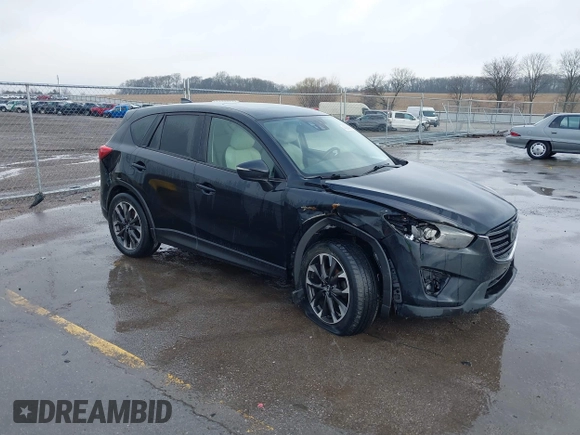 2016 Mazda CX-5 Grand Touring with VIN JM3KE4DY3G0769448, listed as a IAAI auction lot 41947725 with 154,051 mi miles and . Bid and sale history available at carsss.com. Image 1.