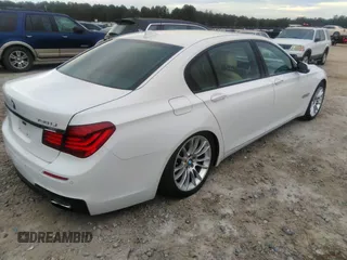 2015 BMW 7 Series 750Li with VIN WBAYE8C50FD781160, listed as a IAAI auction lot 41061232 with 154,496 mi miles. Bid and sale history available at carsss.com. Image 4.