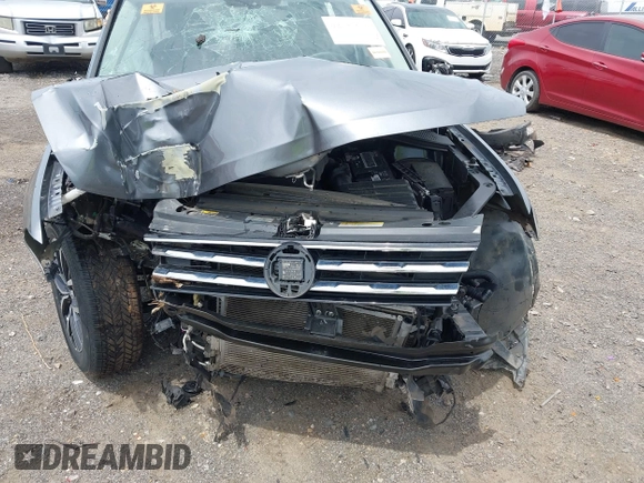 2021 Volkswagen Tiguan SE z VIN 3VV3B7AX8MM159316, wystawiony jako IAAI lot #42525546 z przebiegiem 70 141 mil mil oraz . Historia ofert i sprzedaży dostępna na DreamBid. Obrazek 17.