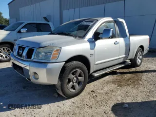 2004 Nissan Titan SE with VIN 1N6AA06AX4N580896, listed as a Copart auction lot 81741484 with 166,016 mi miles and Salvage Title. Bid and sale history available at carsss.com. Image 1.