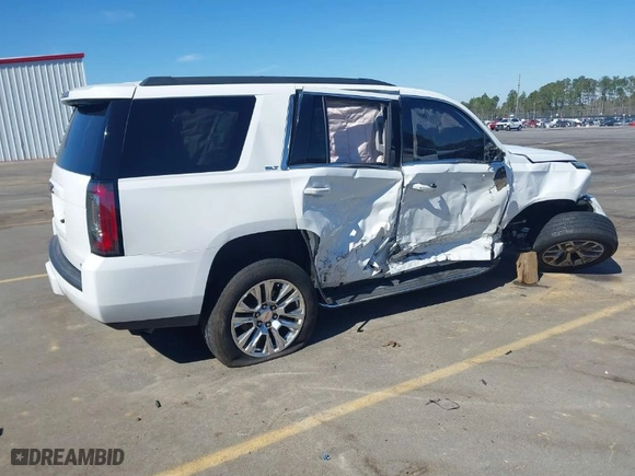 2016 GMC Yukon SLT with VIN 1GKS2BKC2GR310392, listed as a IAAI auction lot 41705560 with 135935 miles. Bid and sale history available at carsss.com. Image 4.