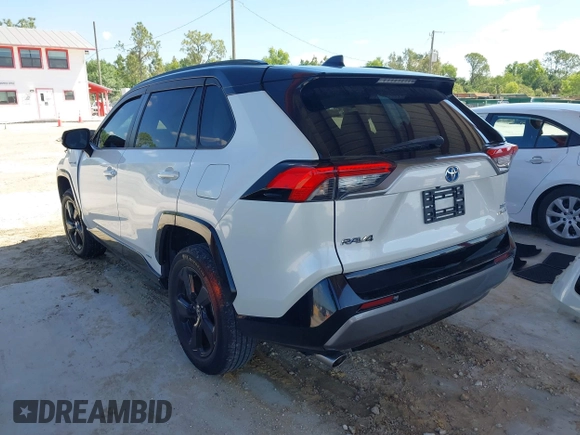 2021 Toyota RAV4 Hybrid XSE with VIN 2T3E6RFV9MW019837, listed as a IAAI auction lot 42002574 with 74,214 mi miles. Bid and sale history available at carsss.com. Image 3.