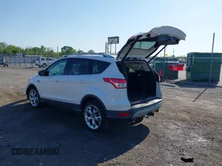 2013 Ford Escape Titanium with VIN 1FMCU0J97DUA70393, listed as a IAAI auction lot 41974106 with 73,548 mi miles and . Bid and sale history available at carsss.com. Image 3.
