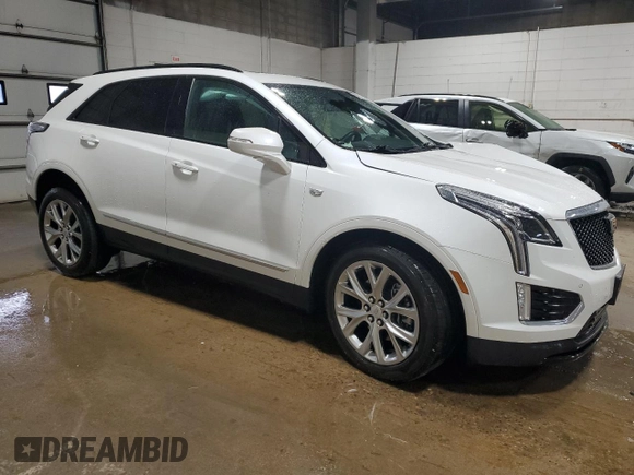 2021 Cadillac XT5 AWD Sport with VIN 1GYKNGRS5MZ142444, listed as a Copart auction lot 54502285 with 27,070 mi miles and Salvage title. Bid and sale history available at DreamBid. Image 4.